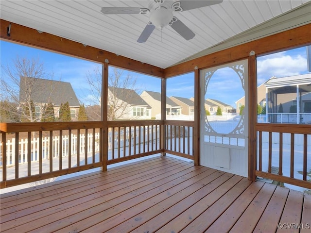 unfurnished sunroom featuring lofted ceiling