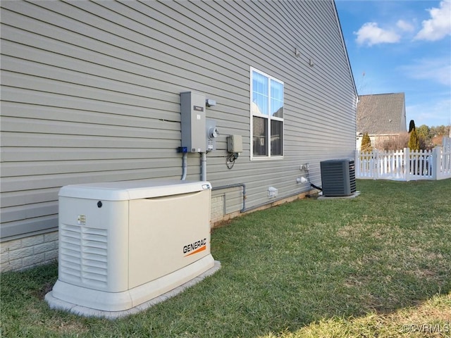 view of property exterior featuring central air condition unit and a yard