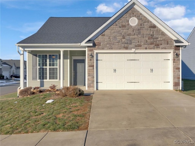 view of front of house with a garage and a front lawn