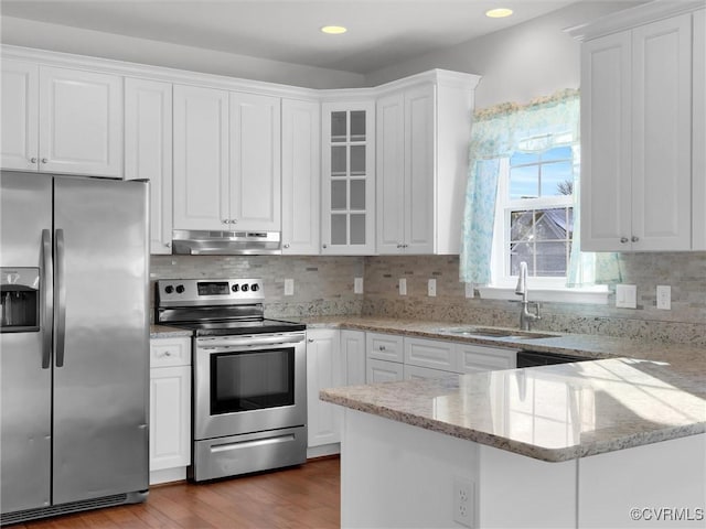 kitchen featuring sink, white cabinetry, and appliances with stainless steel finishes