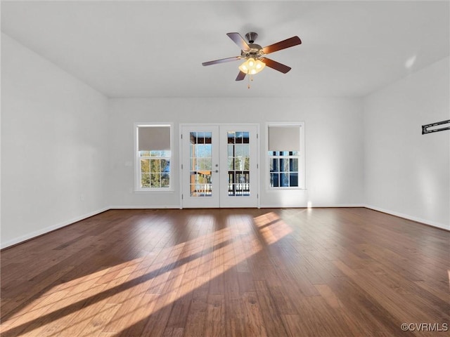 unfurnished living room with ceiling fan, dark hardwood / wood-style floors, and french doors