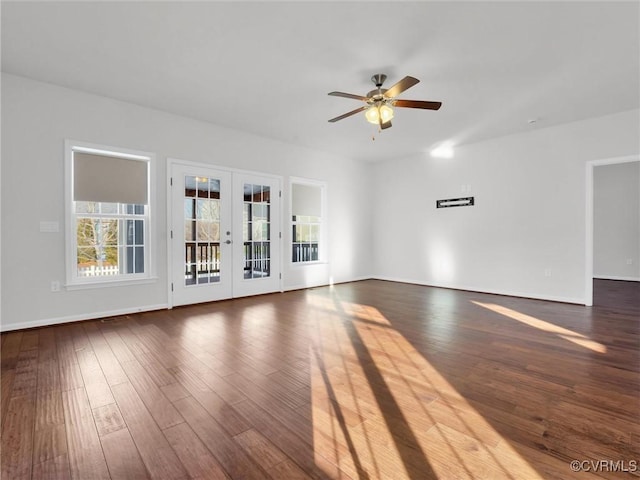 unfurnished living room featuring wood-type flooring, ceiling fan, and french doors