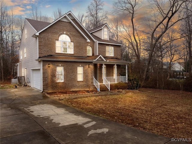 view of front of home featuring a garage and covered porch