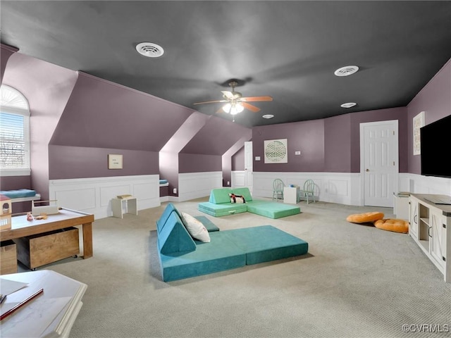 recreation room with light carpet, ceiling fan, and lofted ceiling