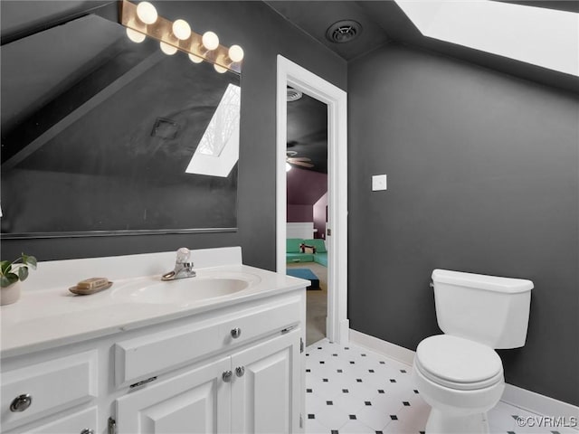 bathroom with ceiling fan, toilet, and vanity