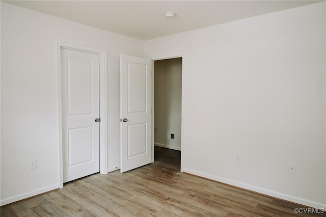 unfurnished bedroom featuring light hardwood / wood-style floors