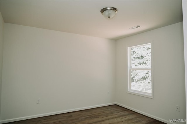 empty room featuring dark hardwood / wood-style floors