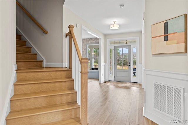 foyer entrance with wood-type flooring