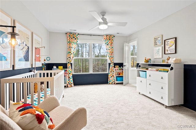 carpeted bedroom with ceiling fan