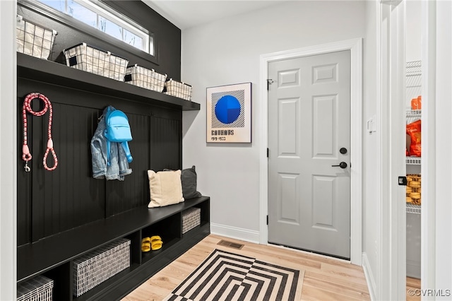 mudroom with hardwood / wood-style floors