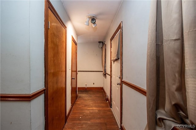 hall featuring dark wood-type flooring