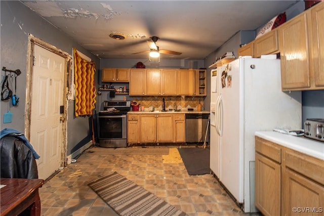 kitchen featuring sink, backsplash, ceiling fan, and appliances with stainless steel finishes