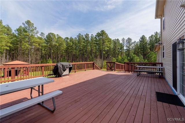 wooden deck with grilling area