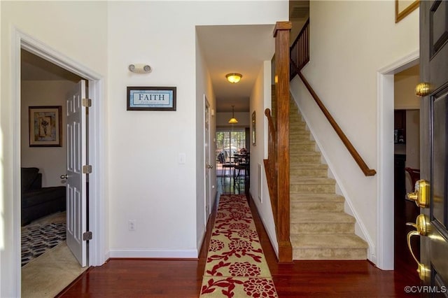 hallway with dark hardwood / wood-style floors