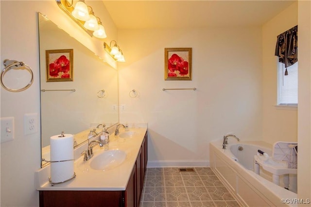 bathroom with vanity, a bath, and tile patterned flooring