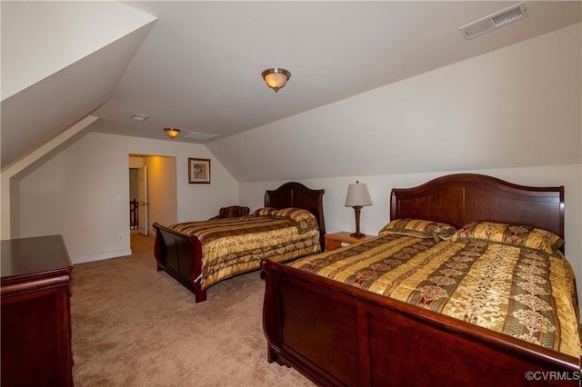 carpeted bedroom with vaulted ceiling