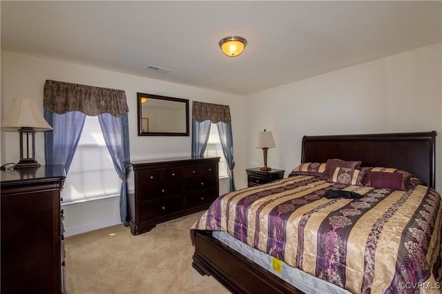 bedroom with light colored carpet