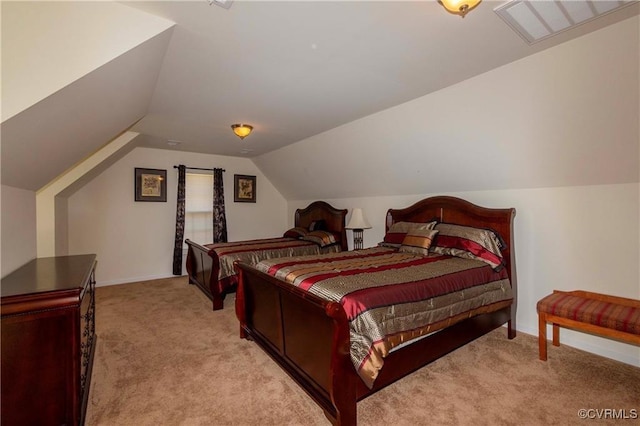 carpeted bedroom with lofted ceiling