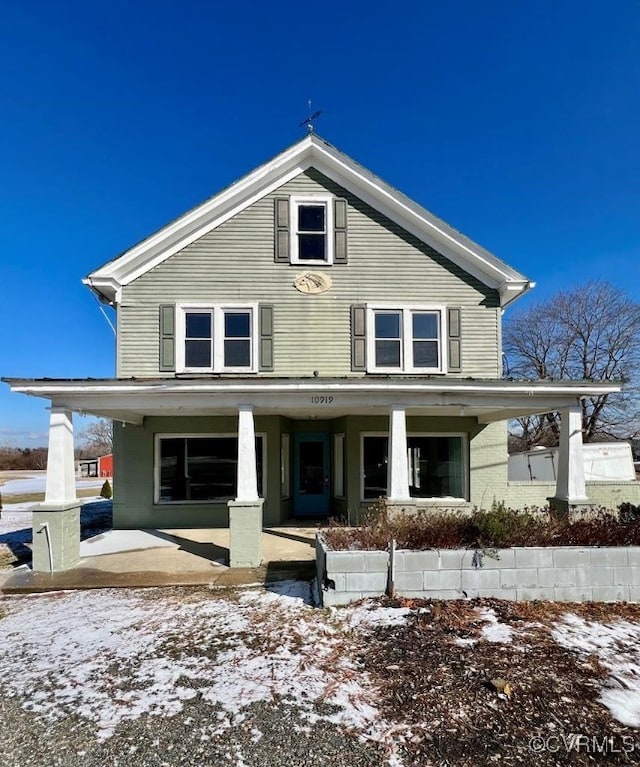 view of front of property featuring covered porch