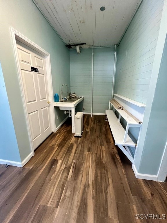 interior space with track lighting and dark wood-type flooring