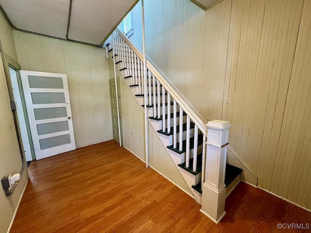 stairway featuring hardwood / wood-style flooring