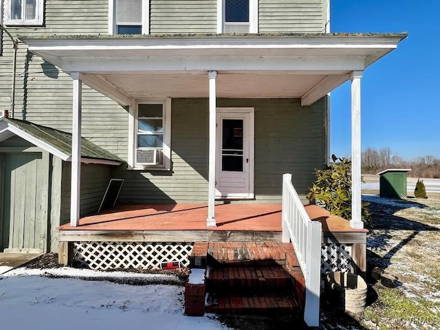 doorway to property featuring covered porch