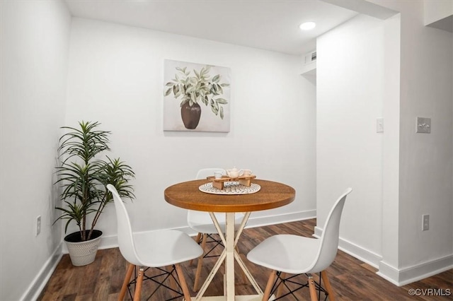 dining space featuring dark hardwood / wood-style flooring