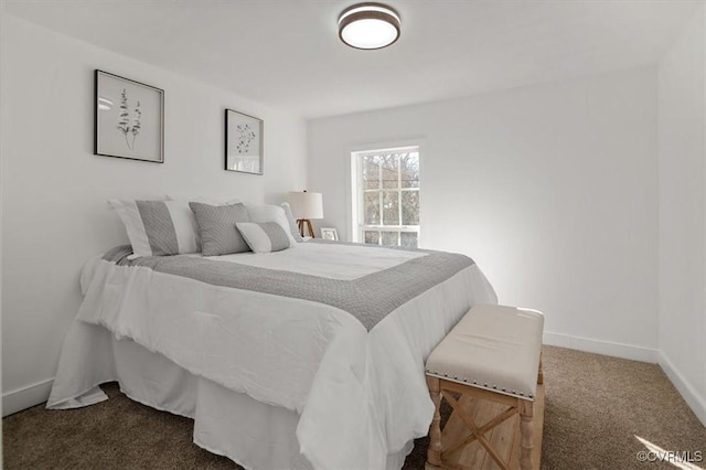 bedroom featuring dark carpet