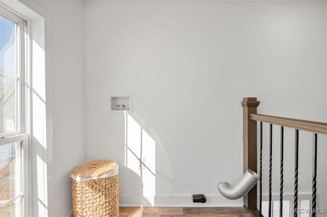 staircase with hardwood / wood-style flooring