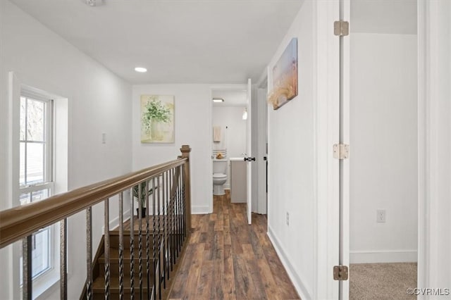 corridor with dark hardwood / wood-style floors