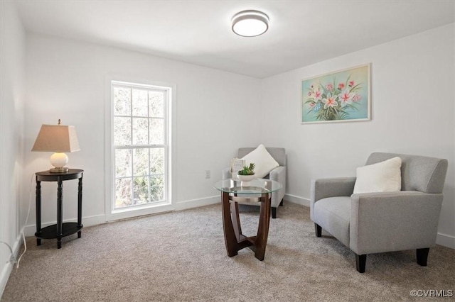 sitting room with light colored carpet and plenty of natural light