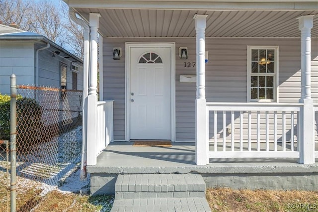 property entrance with covered porch