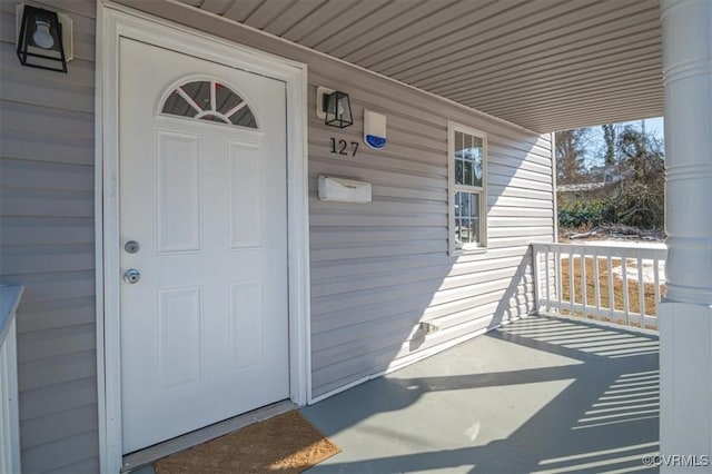 entrance to property with a porch