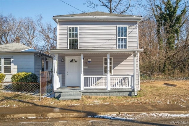 view of property featuring covered porch