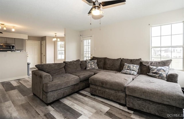 living room with hardwood / wood-style floors and ceiling fan