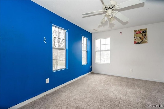 unfurnished room with carpet floors and ceiling fan