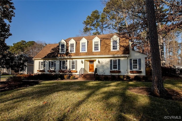 new england style home featuring a front lawn