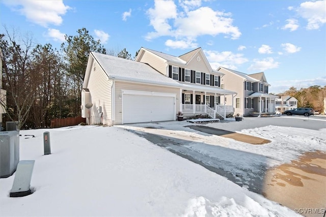 view of front facade with a garage and covered porch