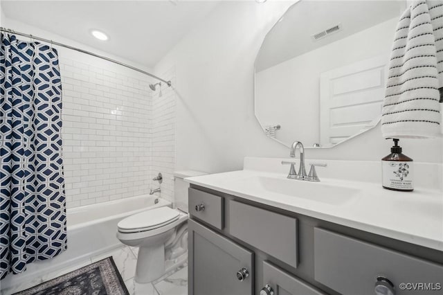 bathroom featuring toilet, visible vents, vanity, marble finish floor, and shower / tub combo with curtain