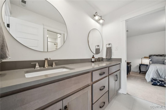 ensuite bathroom featuring double vanity, ensuite bath, visible vents, and a sink