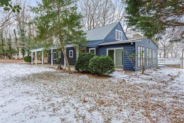 view of snow covered house