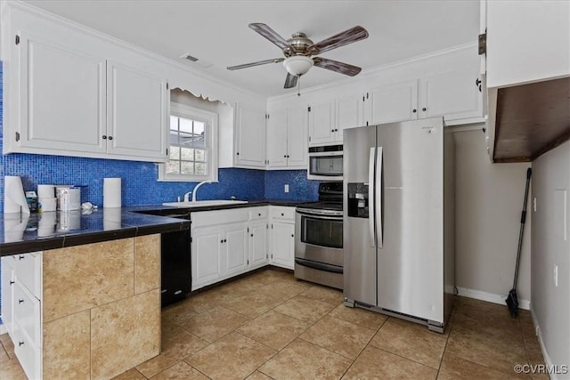 kitchen featuring stainless steel appliances, white cabinetry, sink, and light tile patterned flooring