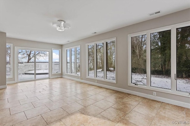 empty room with light tile patterned floors