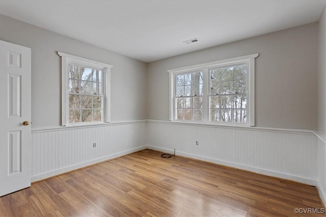 unfurnished room with wood-type flooring