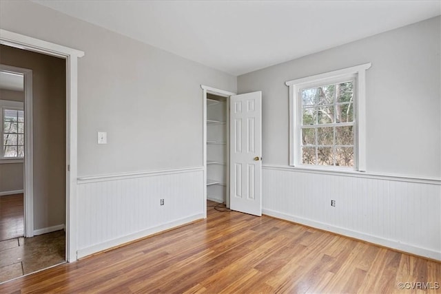 unfurnished bedroom with hardwood / wood-style floors