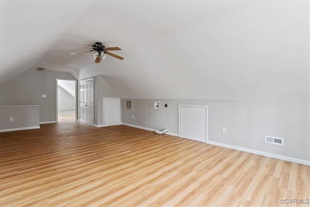 bonus room with ceiling fan, lofted ceiling, and light wood-type flooring