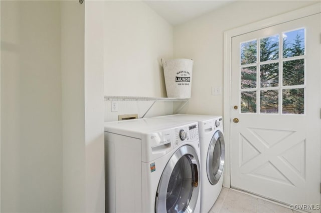 laundry room featuring washing machine and dryer