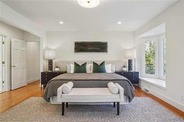 bedroom featuring hardwood / wood-style floors