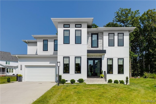 modern home with a garage and a front yard