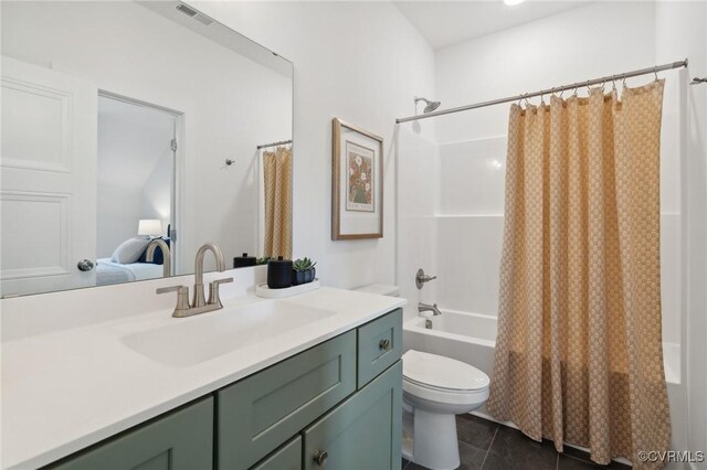 full bathroom featuring vanity, toilet, tile patterned floors, and shower / bath combo